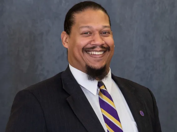 Headshot of donor and alumni DR. WILLIAM J. BROUSSARD ’02 ’07